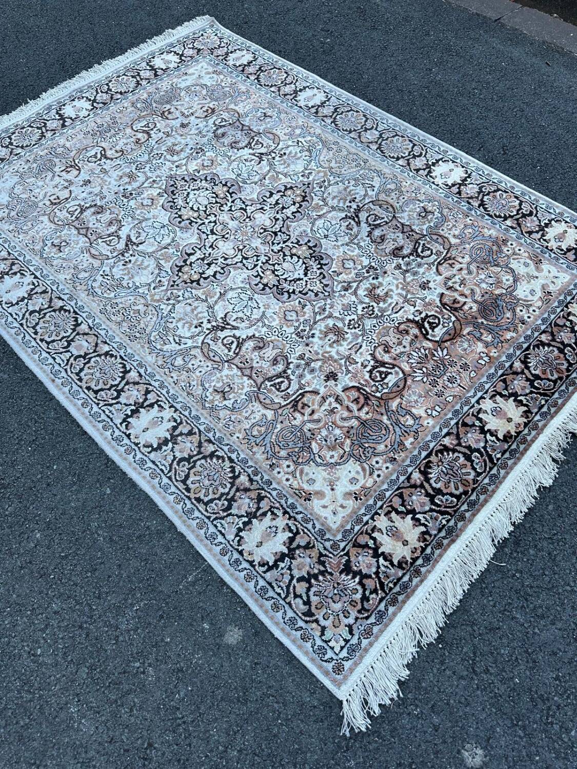 Hand-knotted Persian silk rug