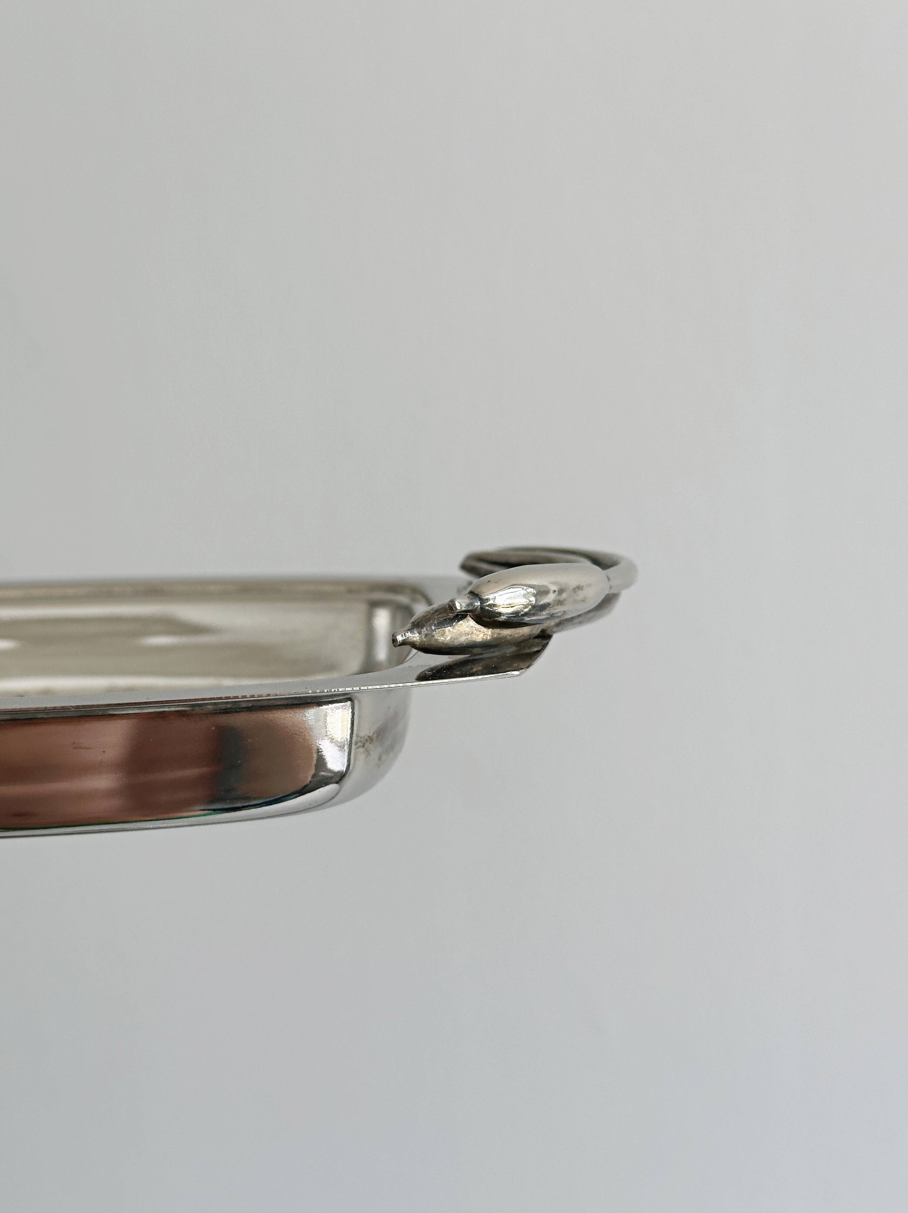Antique shiny metal butter dish