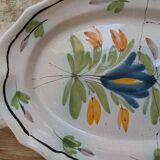 Old oval dish with floral motif called black bottom with staples
