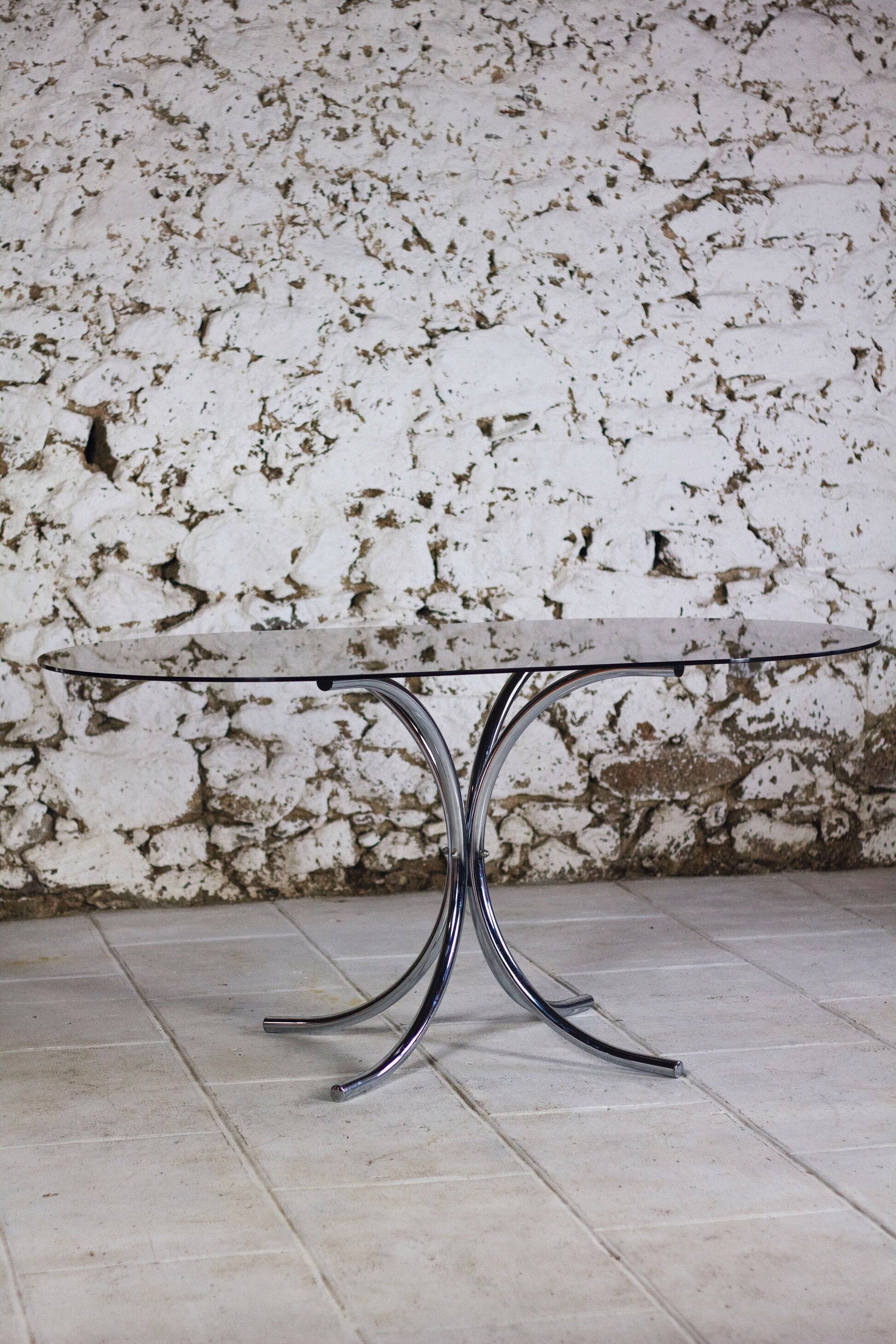 Oval dining table in chrome and smoked glass, 1970.