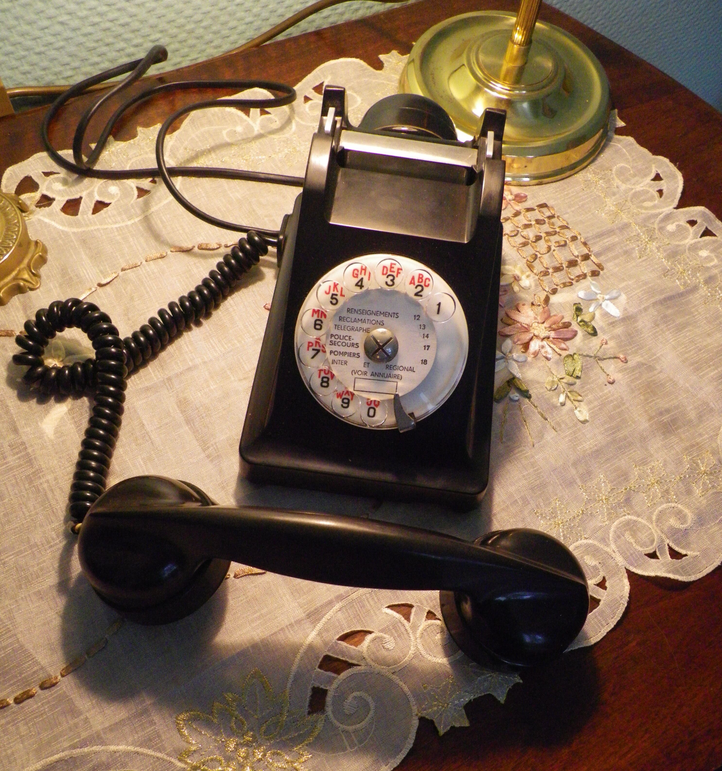 Black bakelite phone with earphone
