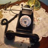 Black bakelite phone with earphone