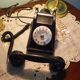 Black bakelite phone with earphone
