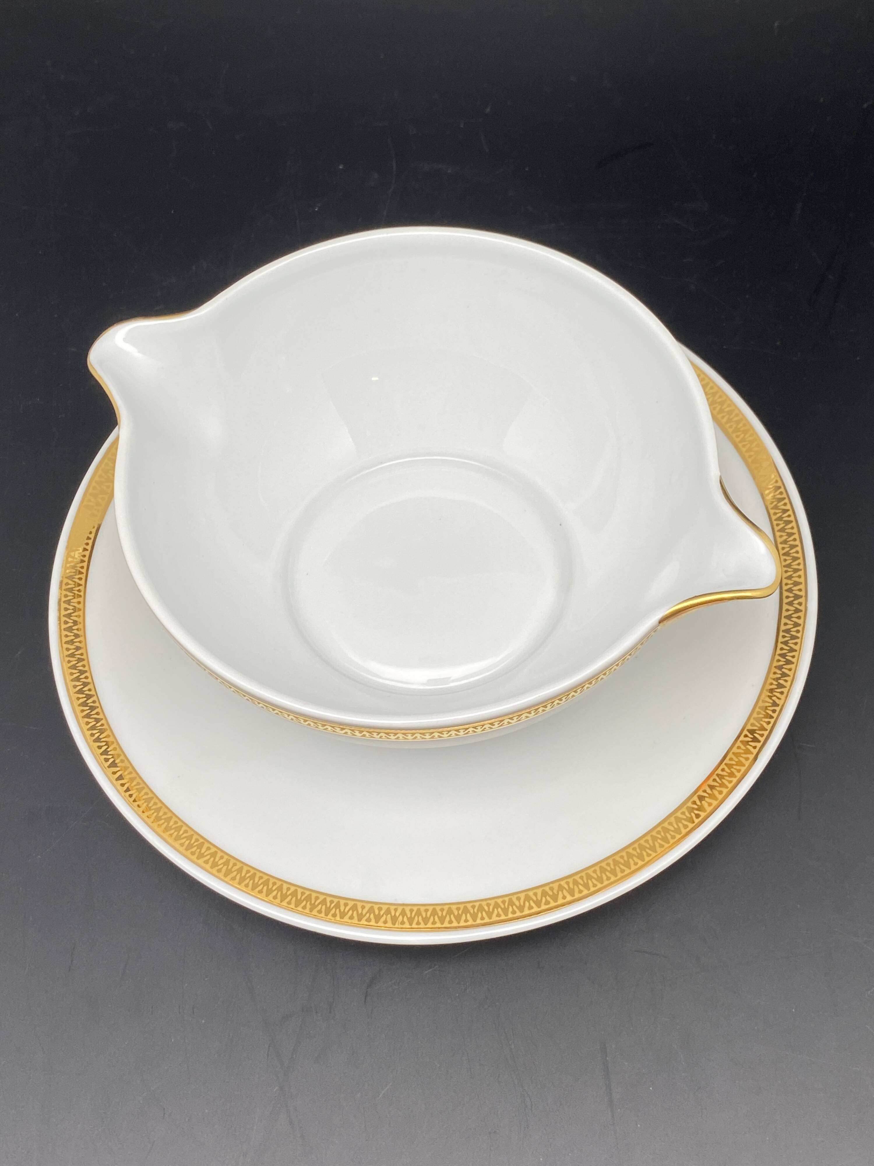 Limoges porcelain gravy boat with gold edging