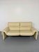 Two-seater designer sofa De Sede DS-2011 in cream leather with adjustable backrest.