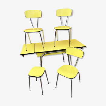 Table in yellow formica with stool and chairs