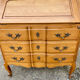 Louis XV style writing desk with a curved back.