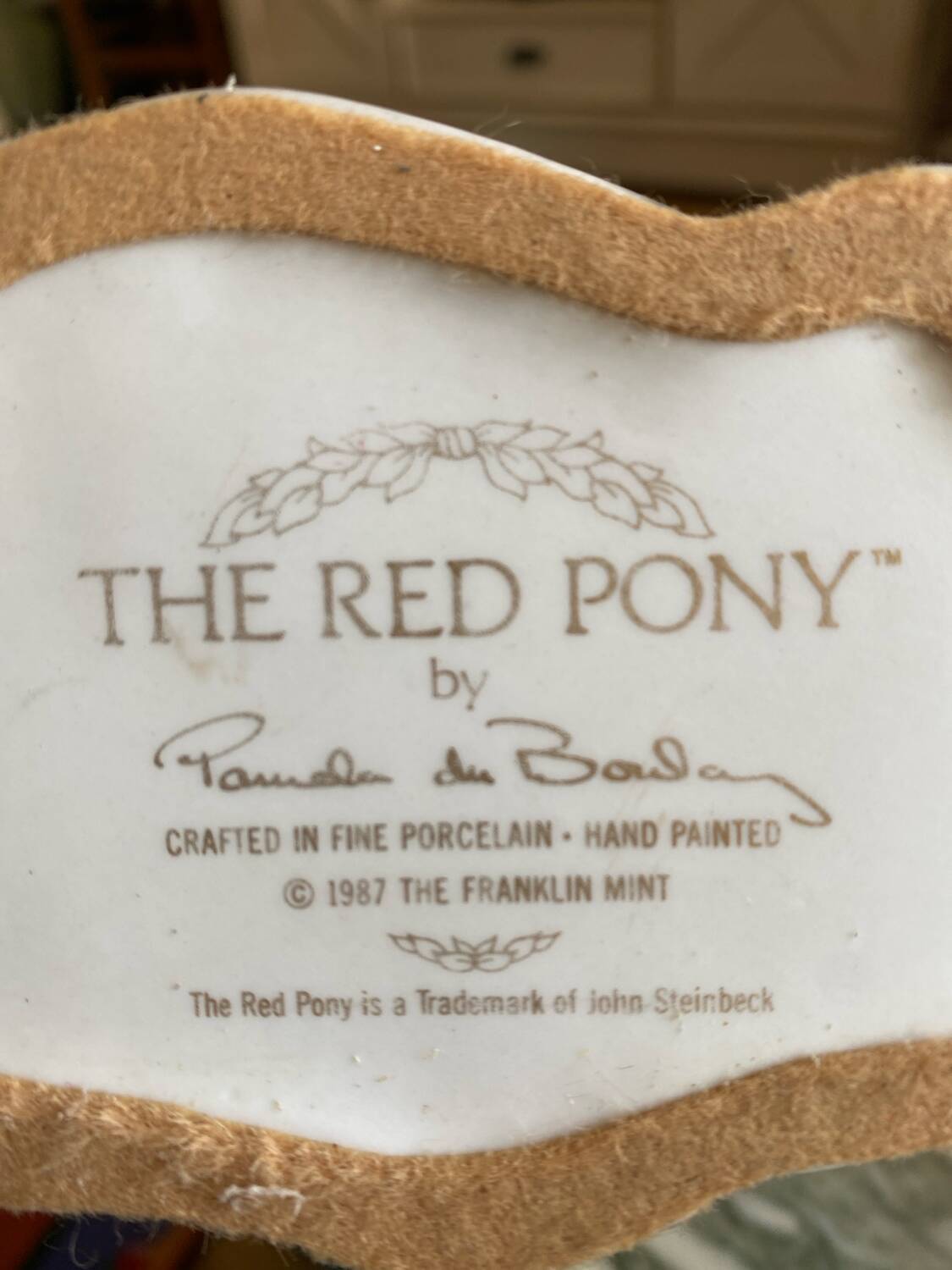 Porcelain horse statue (the red pony)