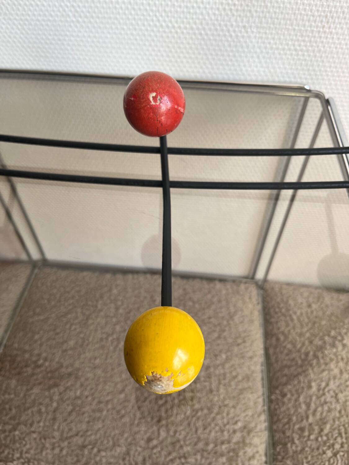 Iron wall coat rack and wooden hooks from the 60s