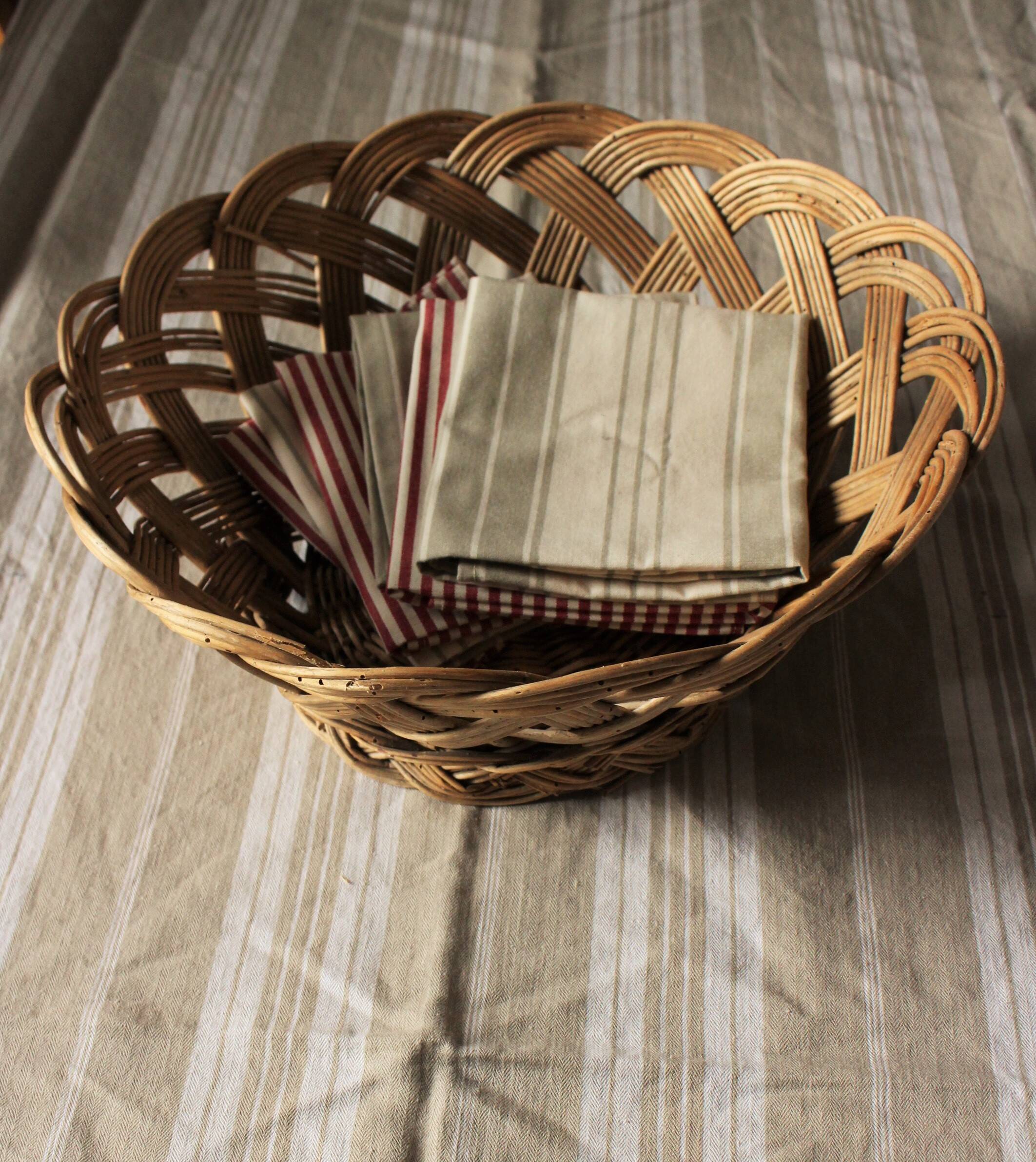 Large vintage twisted wicker basket on a stand