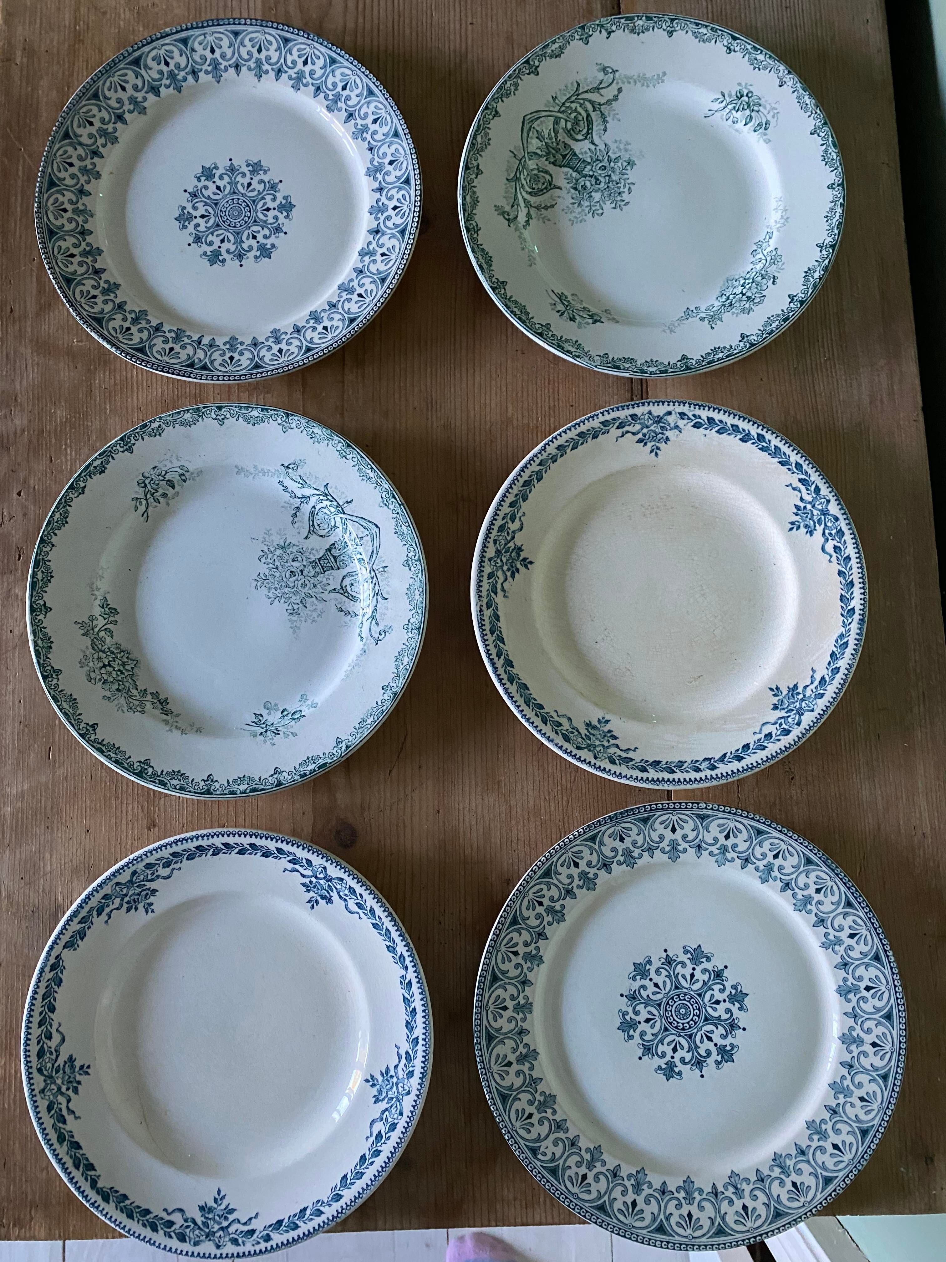 Set of 6 old flat plates in mismatched iron earth