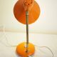 Orange colored metal desk lamp from the 1960s-1970s