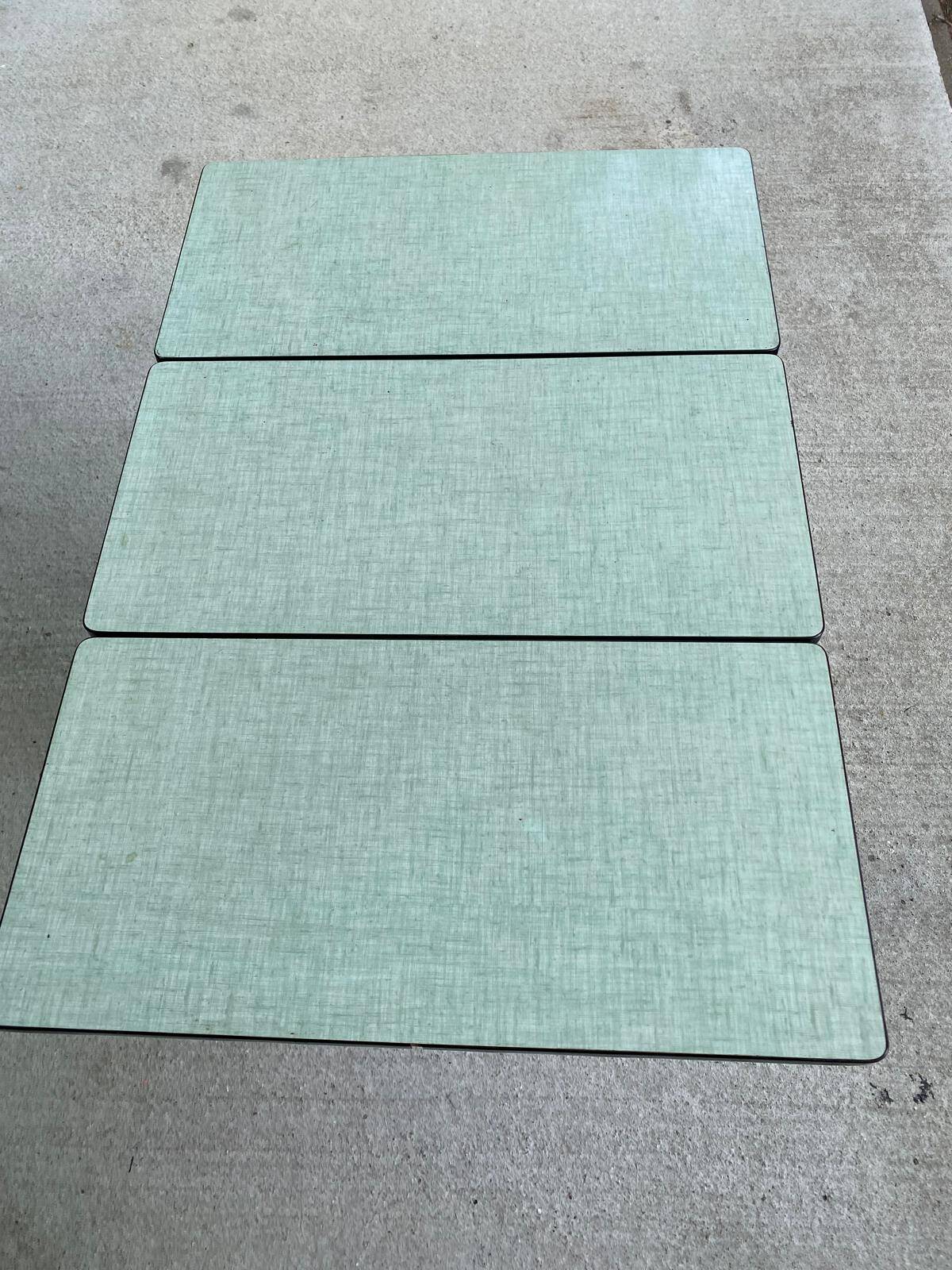 Folding and extending kitchen table in steel and aqua green wood