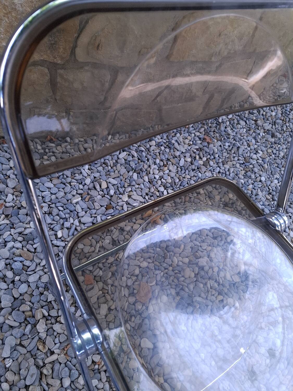 2 folding chairs designed by Giancarlo Piretti for Castelli