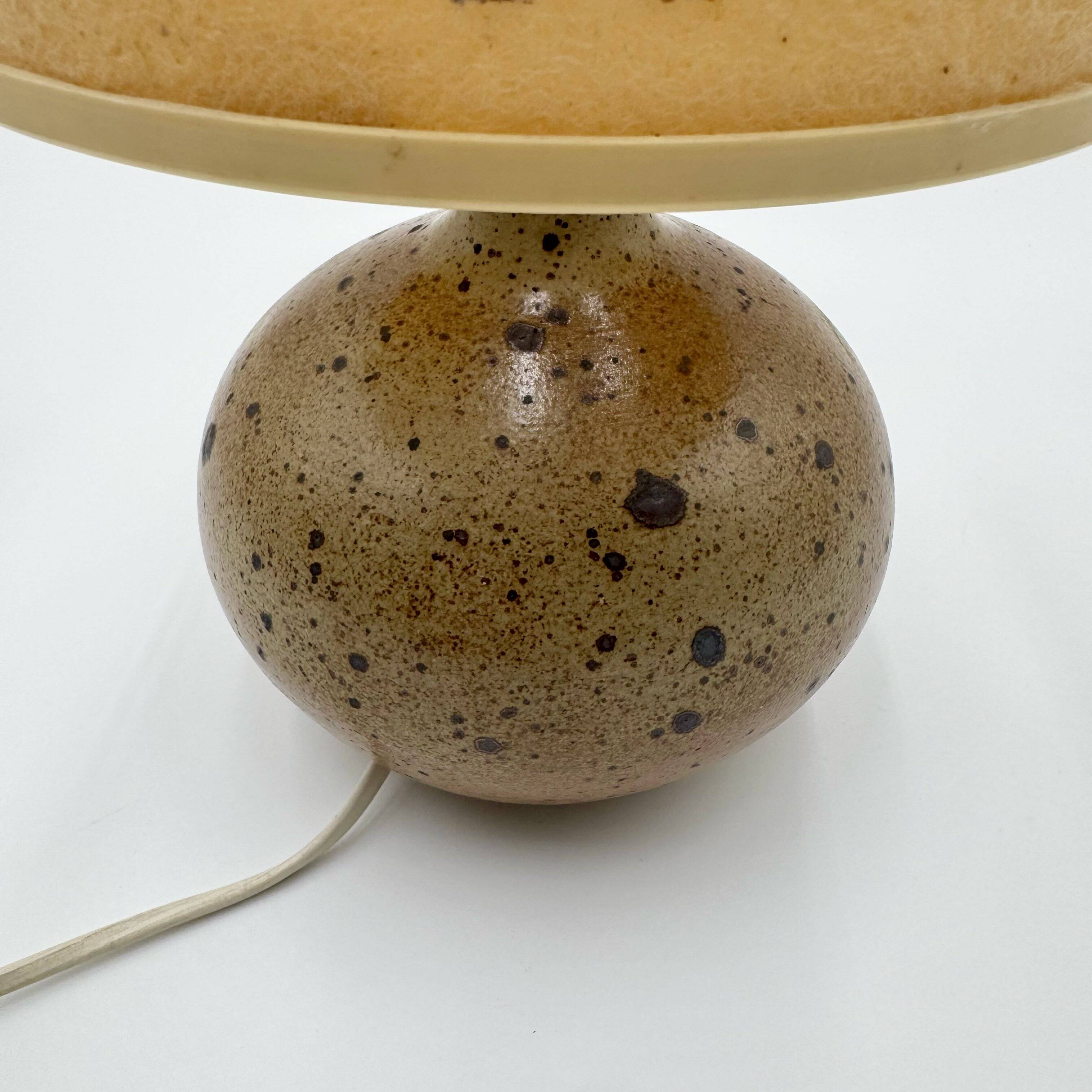 Pyrite stone ball lamp with a lampshade featuring dried flower inclusions.