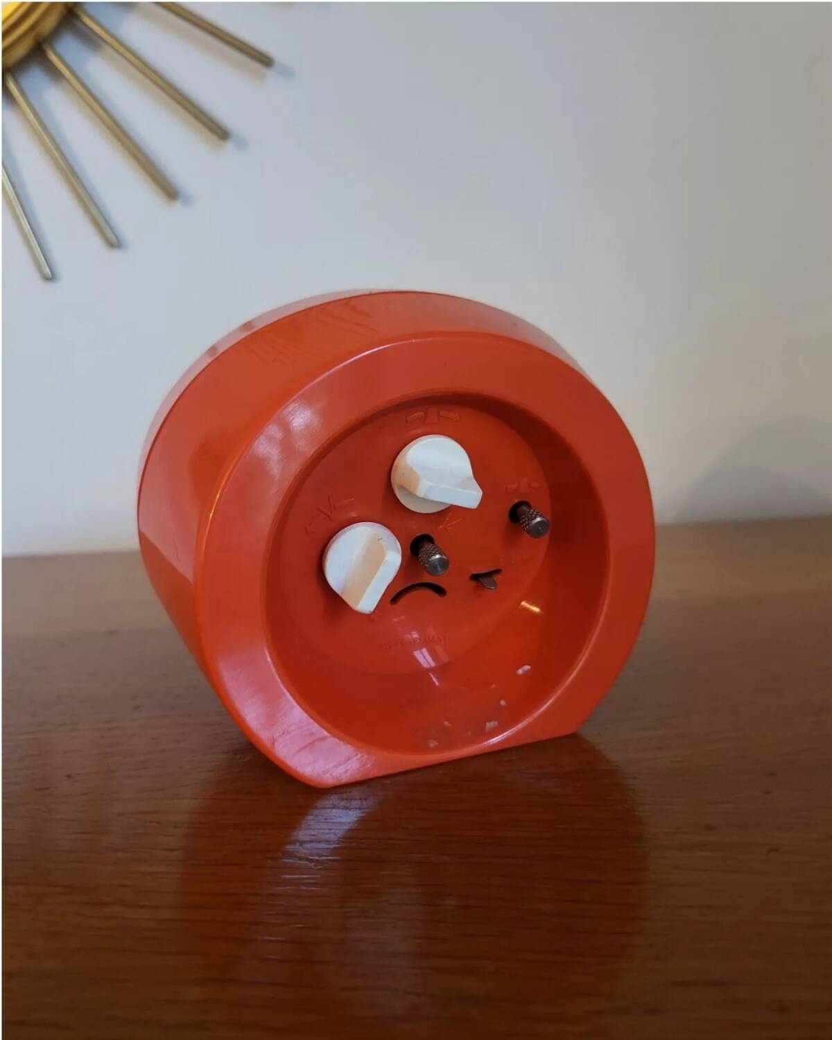 Vintage mechanical alarm clock in orange plastic Uti West Germany