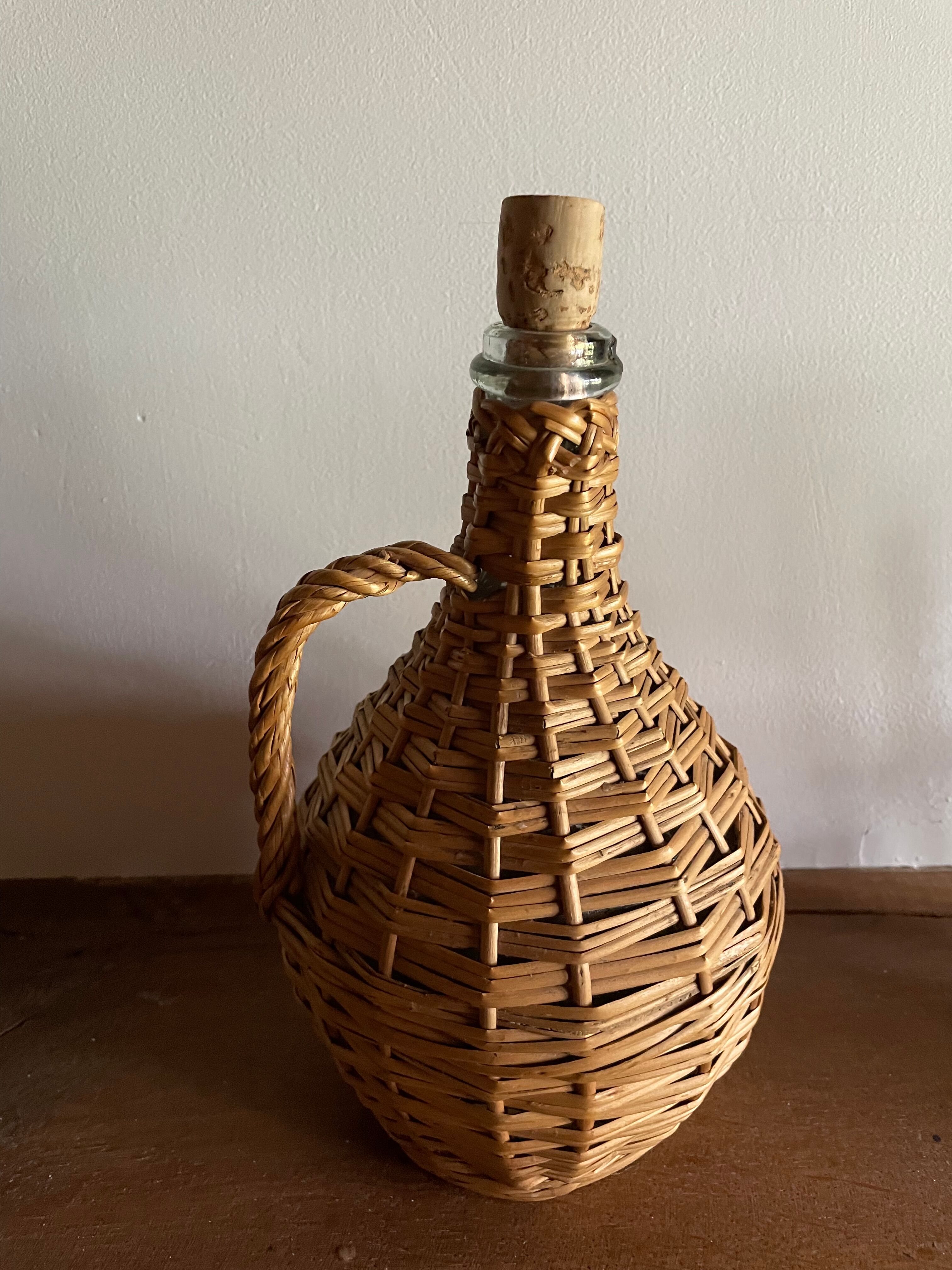 Glass bottle surrounded by wicker