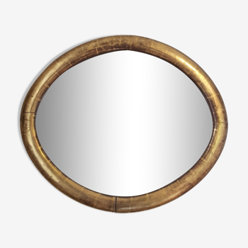 Miroir ovale à la feuille d'or