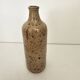 Pyrite stoneware single-flower vase in the shape of a bottle signed Aular?