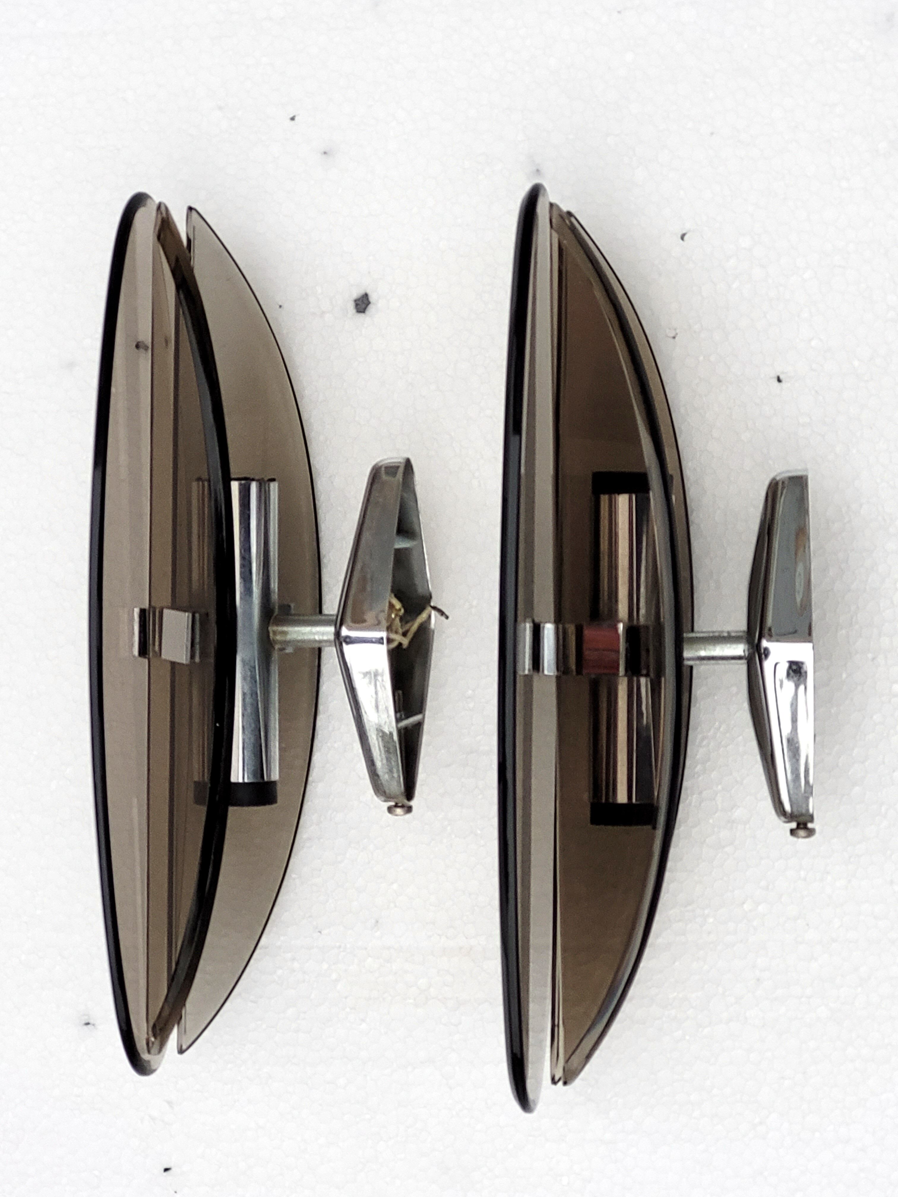 Pair of elliptical italian wall lamps in smoked glass and chrome veca