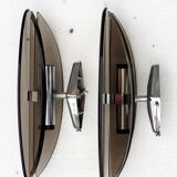 Pair of elliptical italian wall lamps in smoked glass and chrome veca
