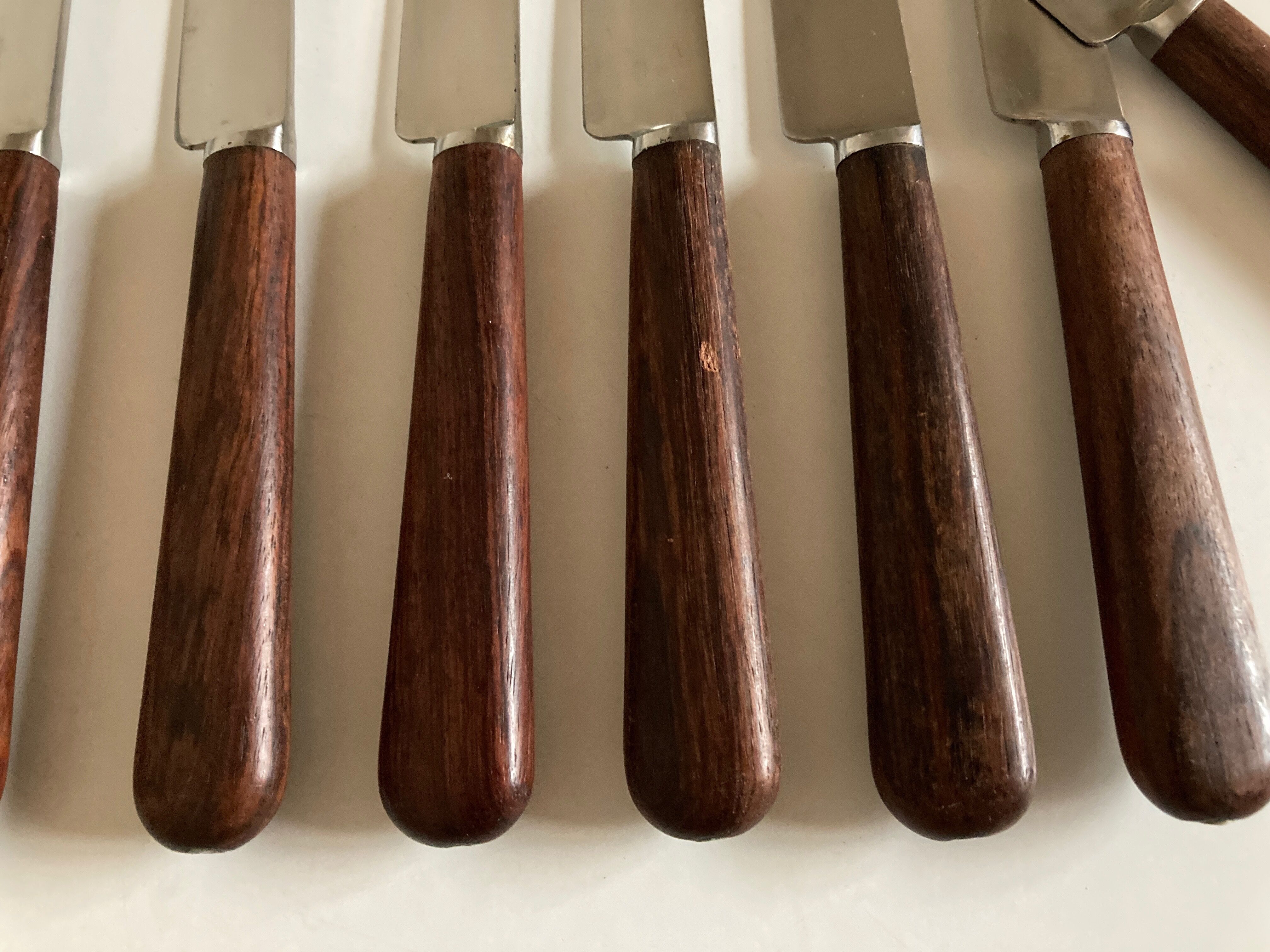 Set of 9 knives with mid century rosewood handle