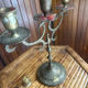 Vintage brass candelabrum engraved with three lights and a snuffer.