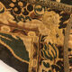 Tapestry decorated with a pink flamingo in a green landscape, woven by hand