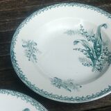 Set of three iron earthenware plates from the St Amandinoise earthenware factory, lily of the valley model.