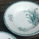 Set of three iron earthenware plates from the St Amandinoise earthenware factory, lily of the valley model.