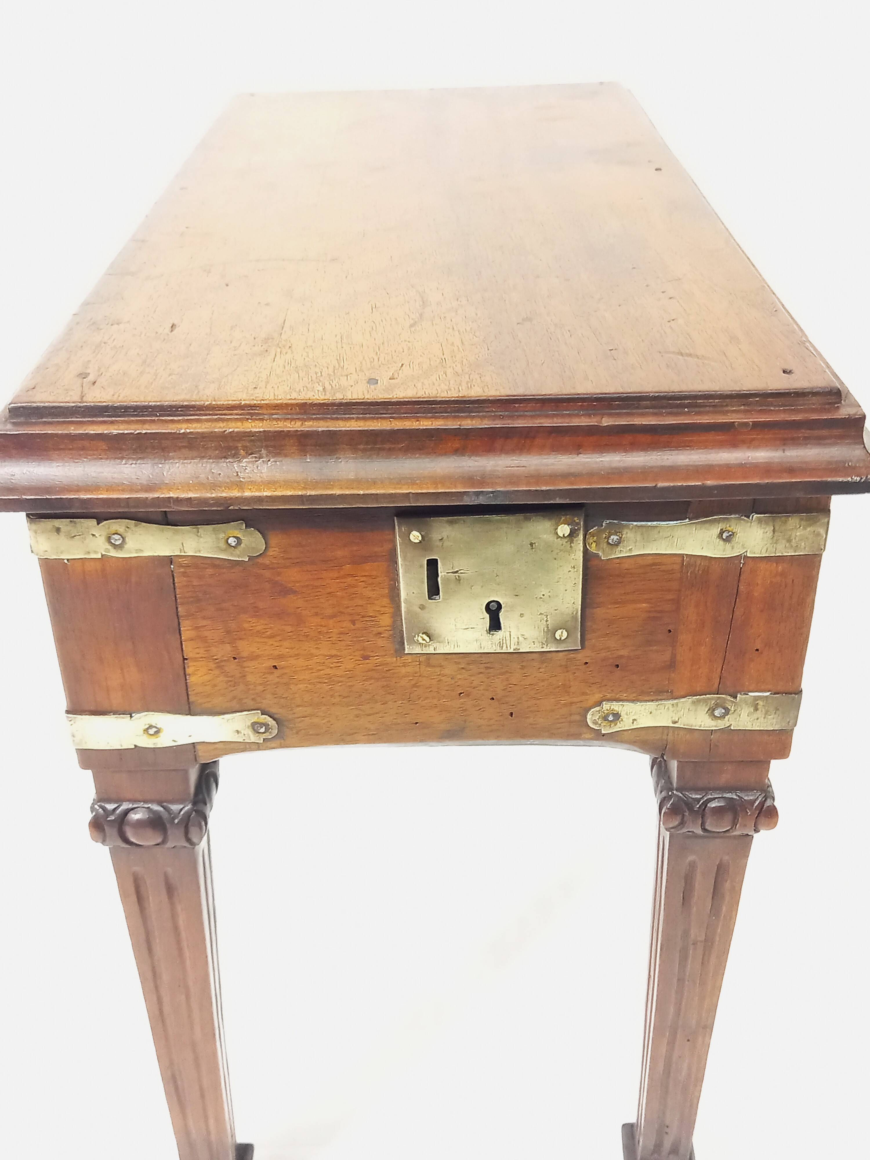 Small old side table with brass finishes