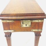 Small old side table with brass finishes