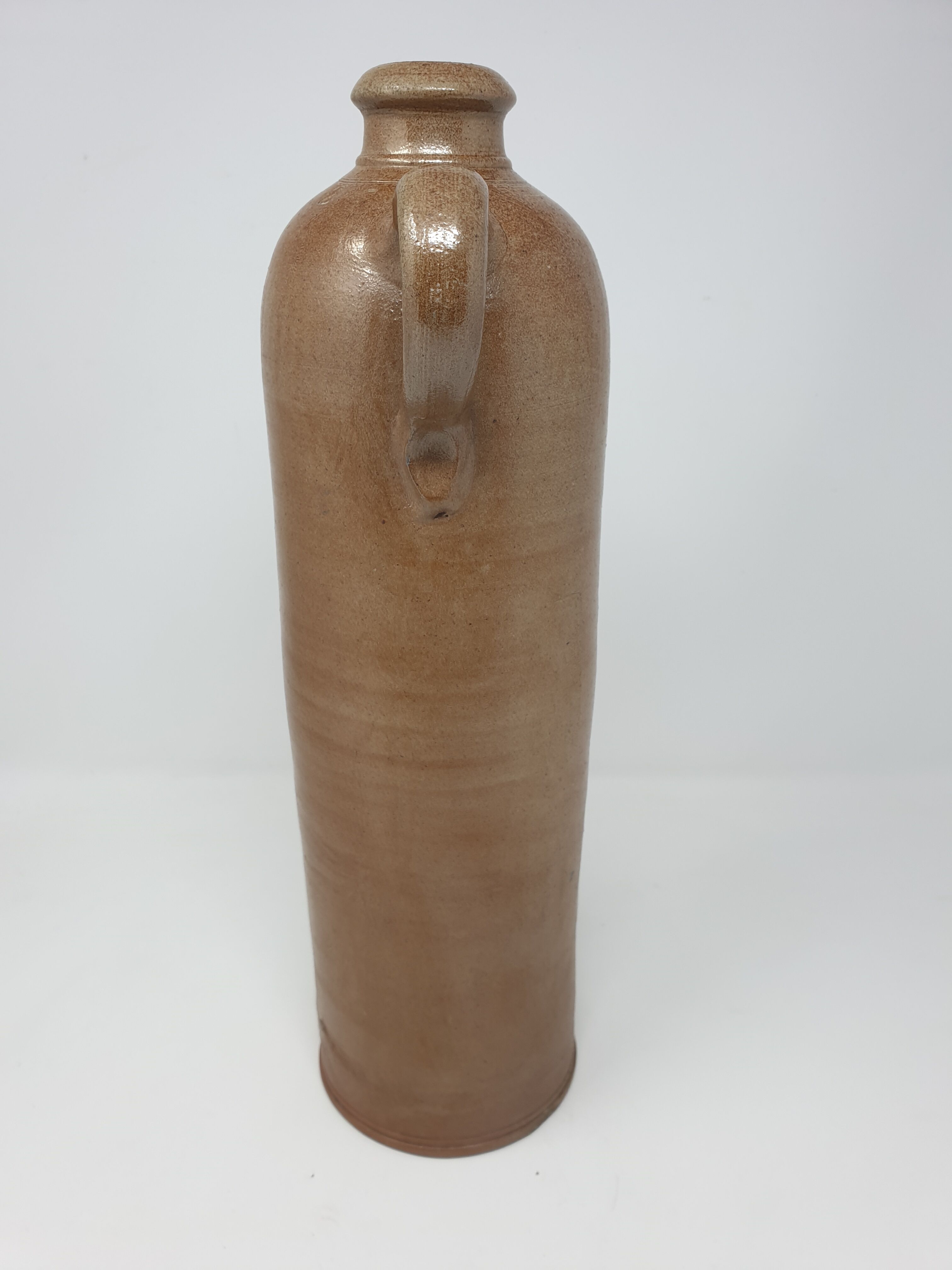 Old stoneware bottle with handle
