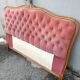 antique wooden and fabric headboard