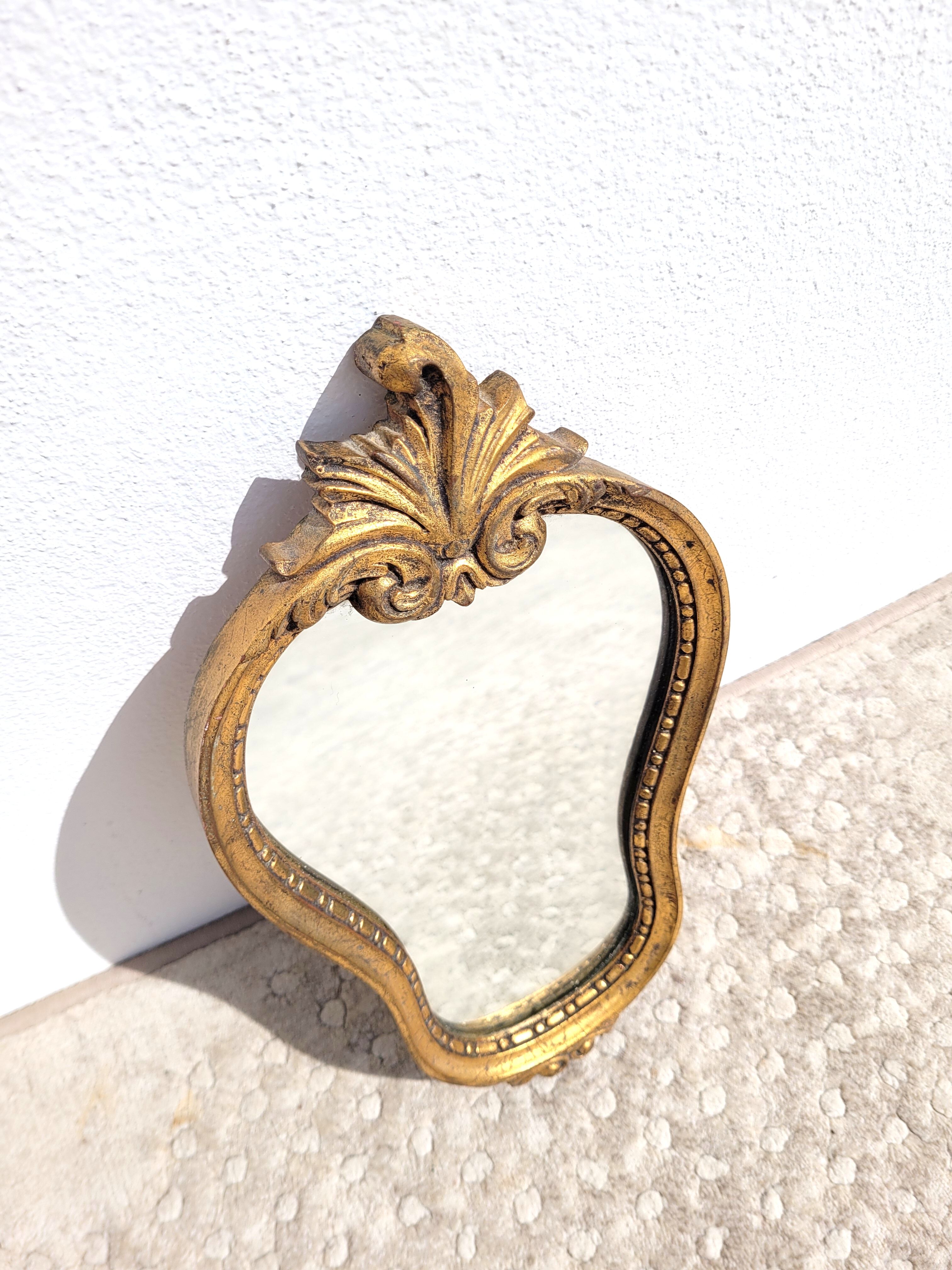 Small gilded mirror with pediment 1960