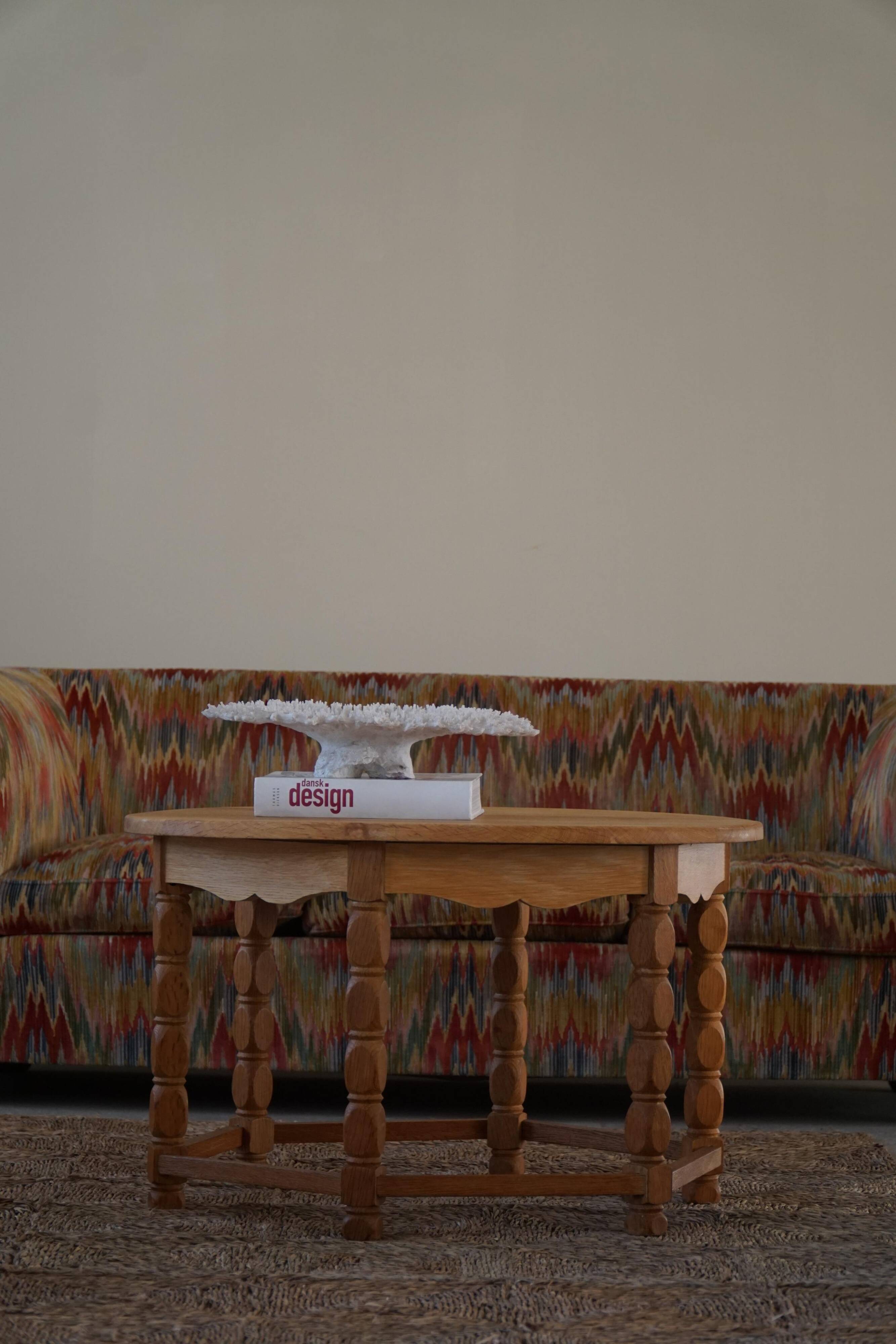 Danish modern and brutalist round coffee table in solid oak, 1960s.