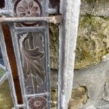 Pair of old double stained glass doors. Metal frames. Stained glass windows