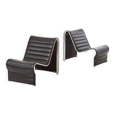 Modern black leather lounge chairs with an aluminium frame.