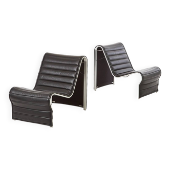 Modern black leather lounge chairs with an aluminium frame.