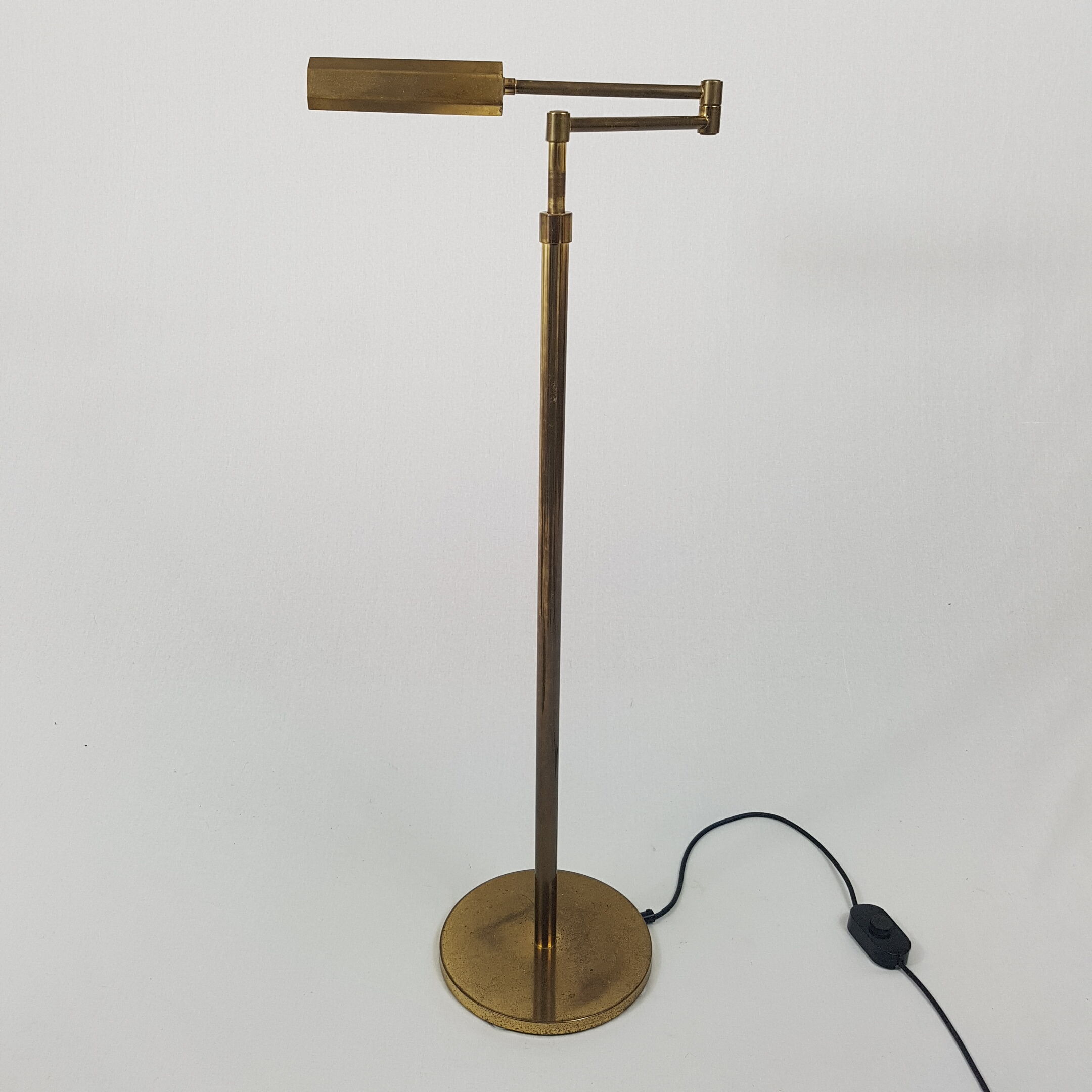Articulated brass floor lamp