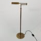Articulated brass floor lamp