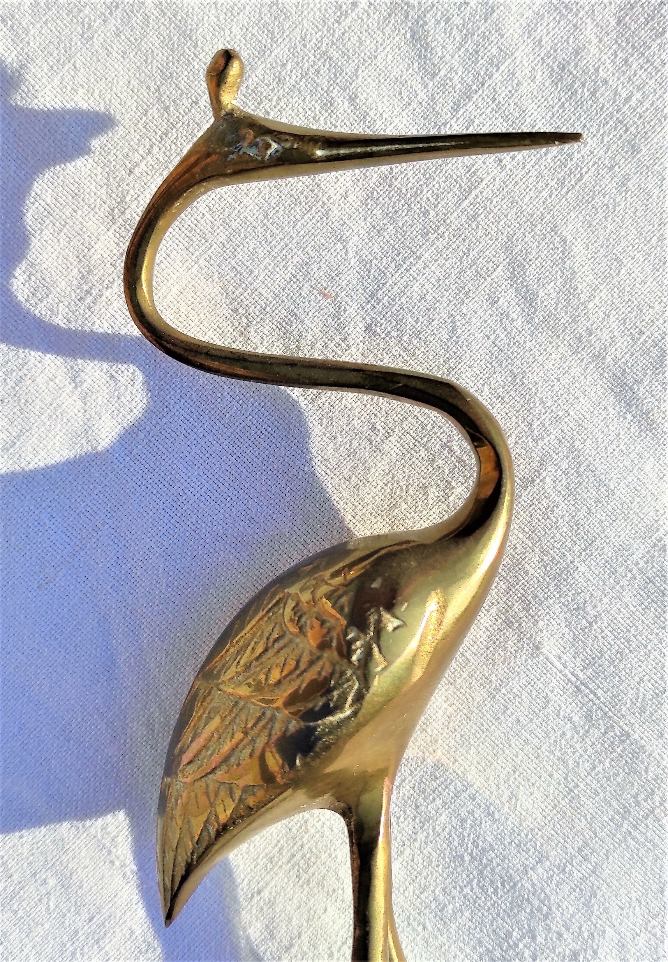 Heron or brass wading bird around the 1960s/1970s