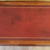 English wooden desk on top of leather