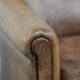 Vintage sheepskin armchair with a beautiful light colour and elegant legs