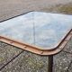 Table with an old ship porthole in brass and a metal base / 100 x 85 x 76 cm