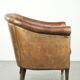 Vintage sheepskin club armchair finished with decorative nails