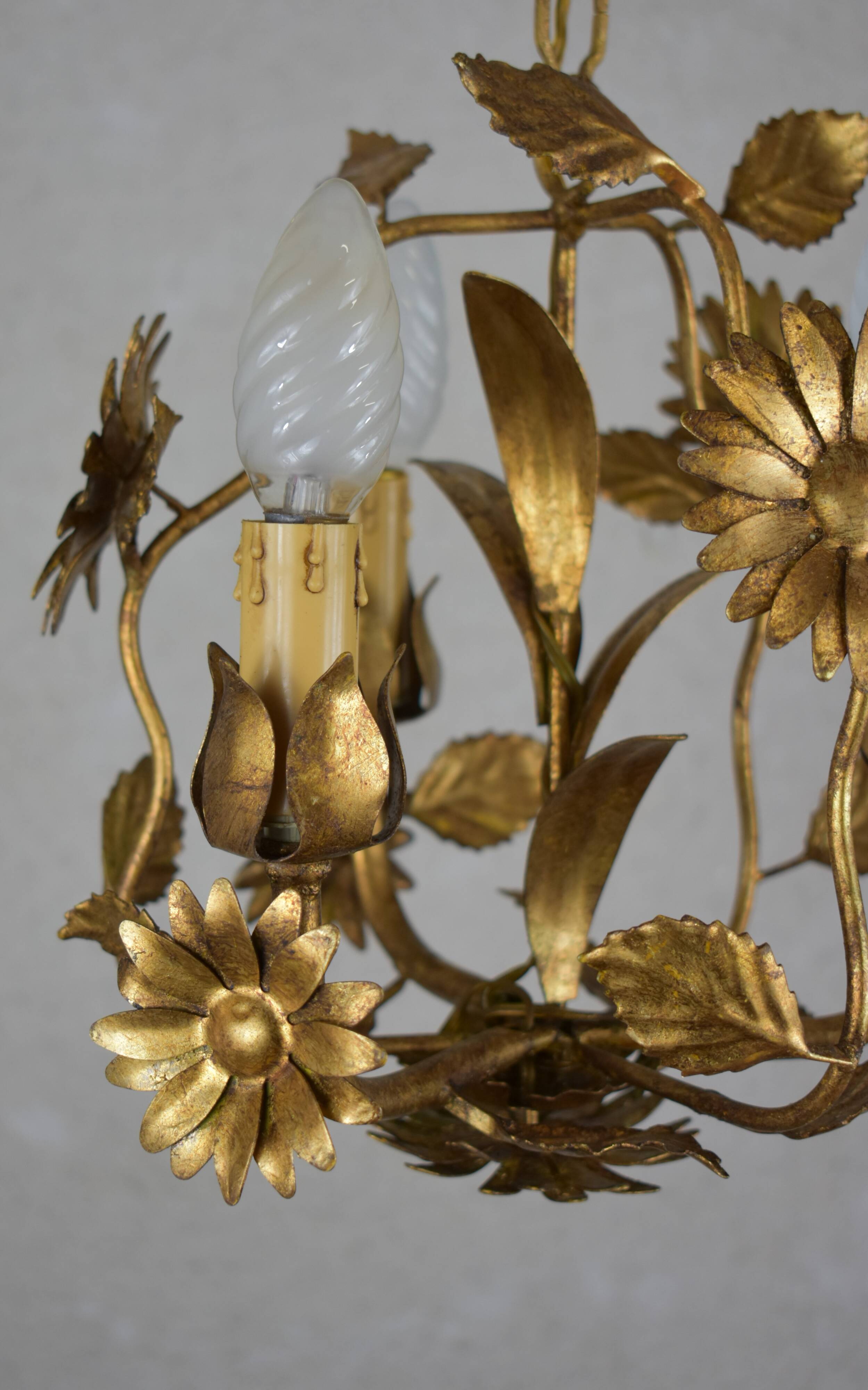 golden chandeliers with flowers.