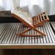 Wooden footrest and vintage tapestry
