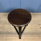 Unmarked black Rowac stool with a dark wood seat.