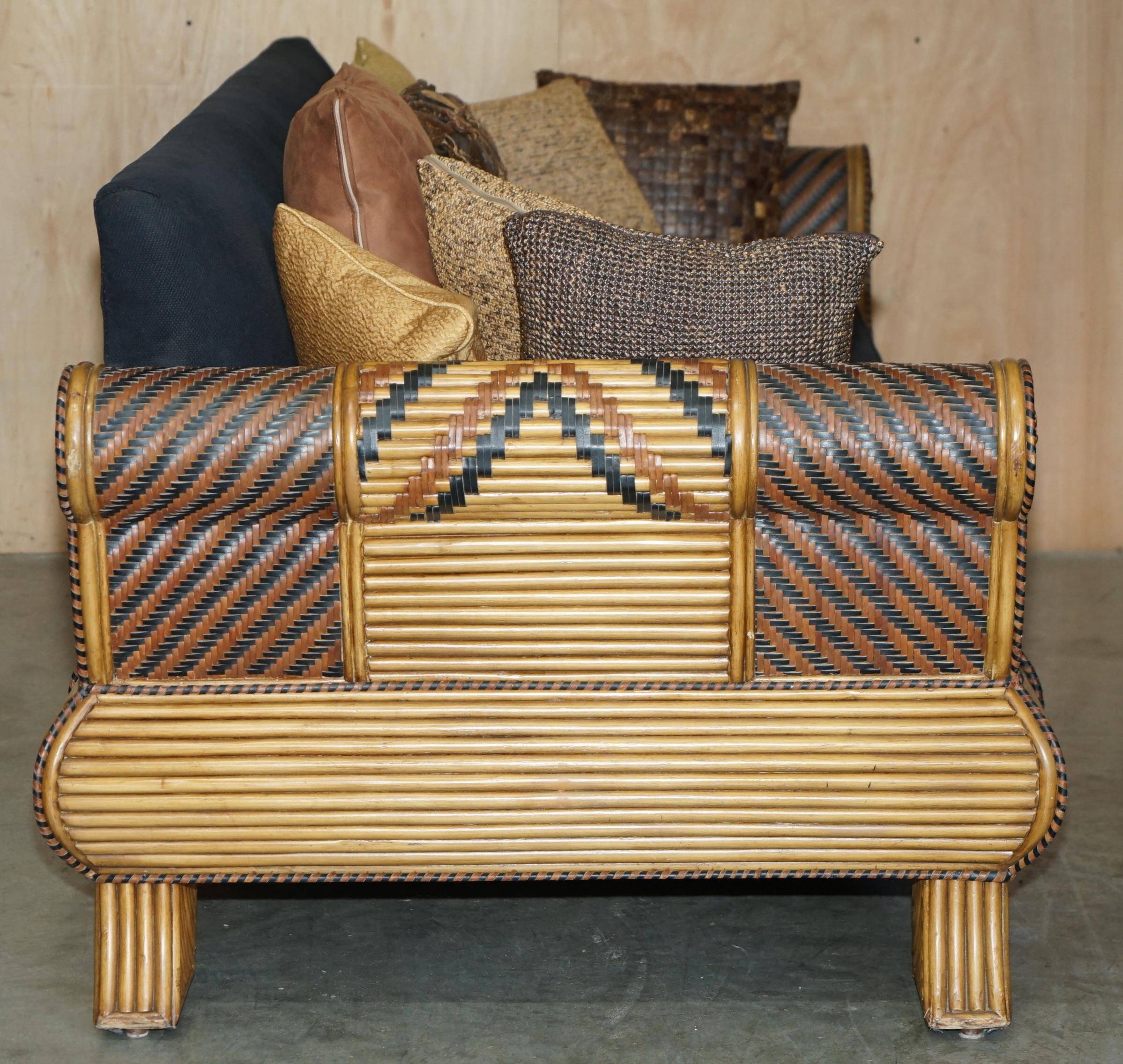 Vintage 1970s canapé with bamboo frame and Aztec patterns.